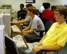 Cameron Bain works on a game with fellow computer science campers.